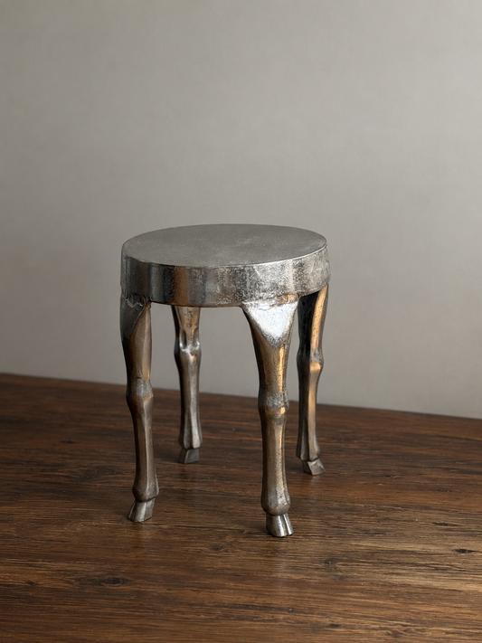 CAST ALUMINUM STOOL WITH HOOF-FOOTED LEGS