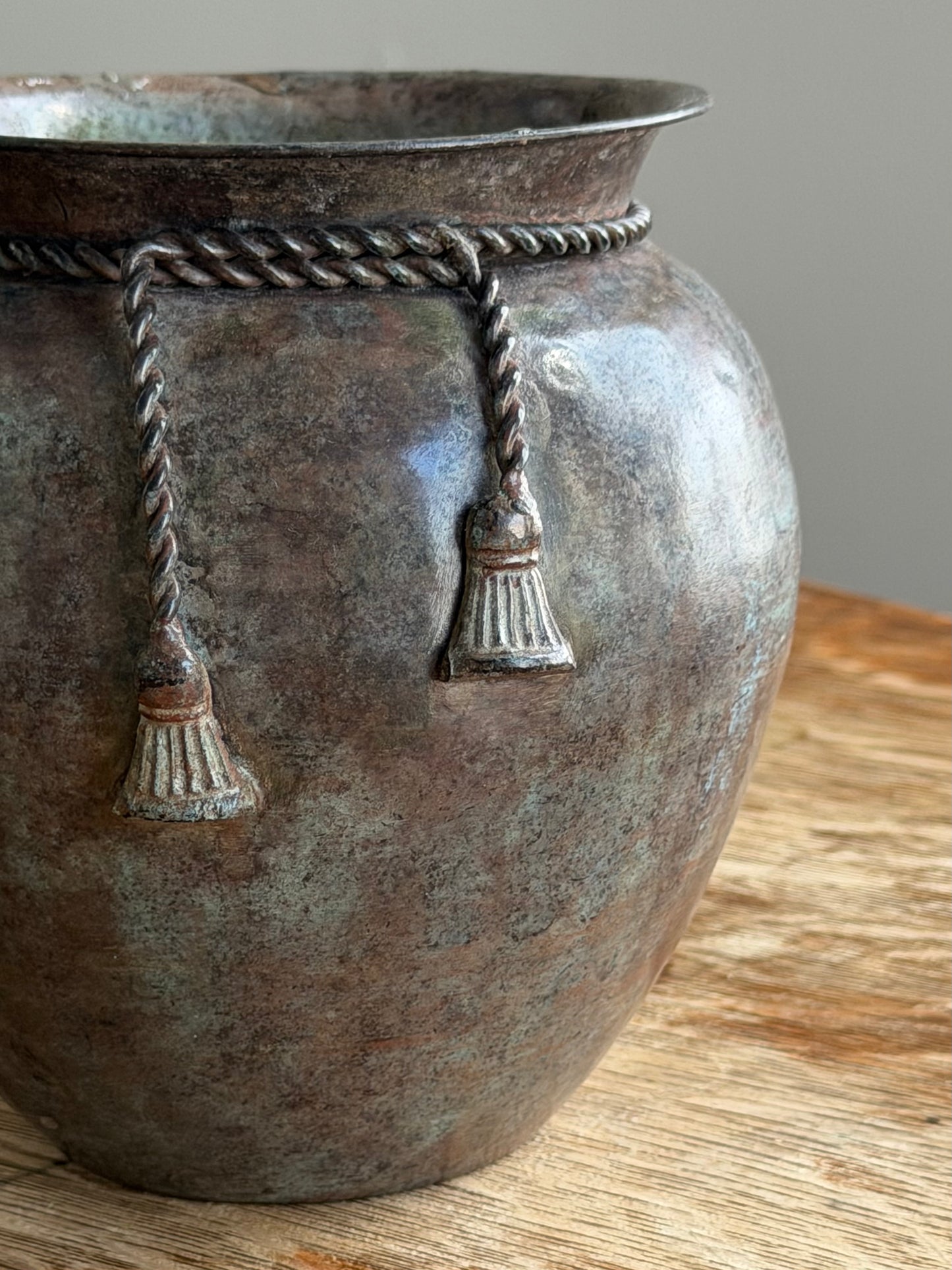 PATINATED VESSEL WITH TASSEL DETAIL