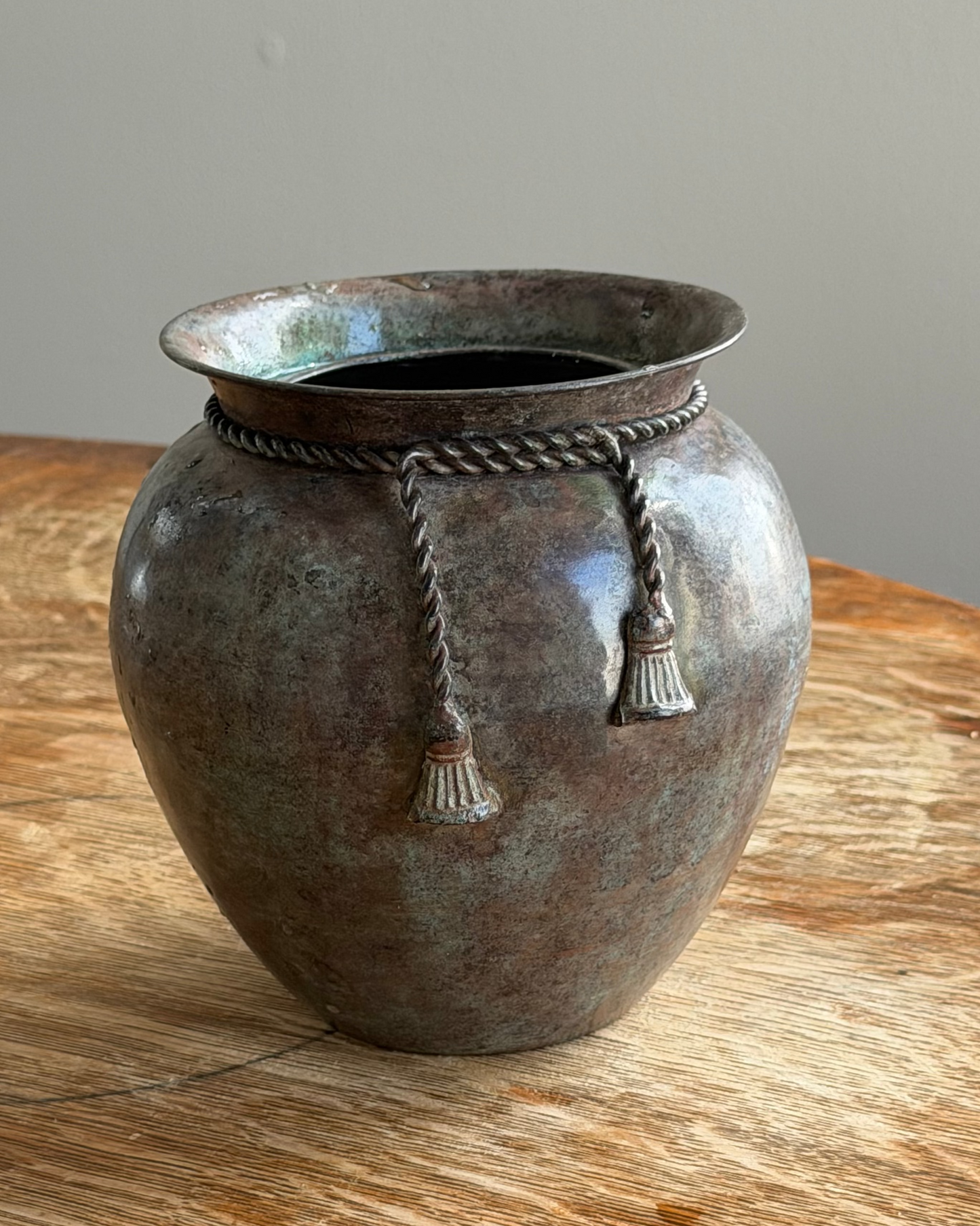 PATINATED VESSEL WITH TASSEL DETAIL