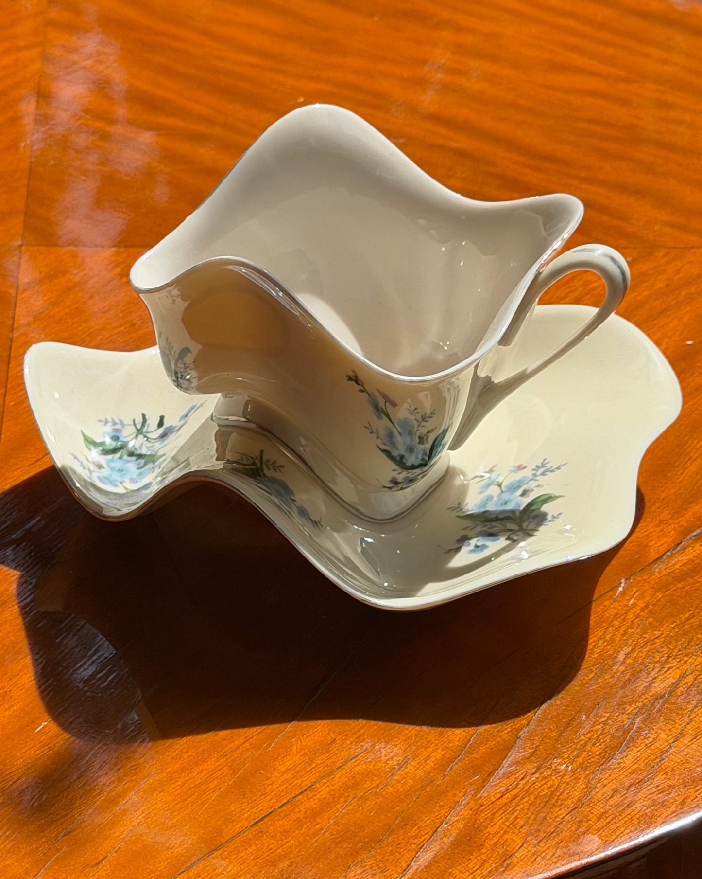 PORCELAIN TEACUP AND SAUCER BY ROBERT LAZZARINI (c. 2003)